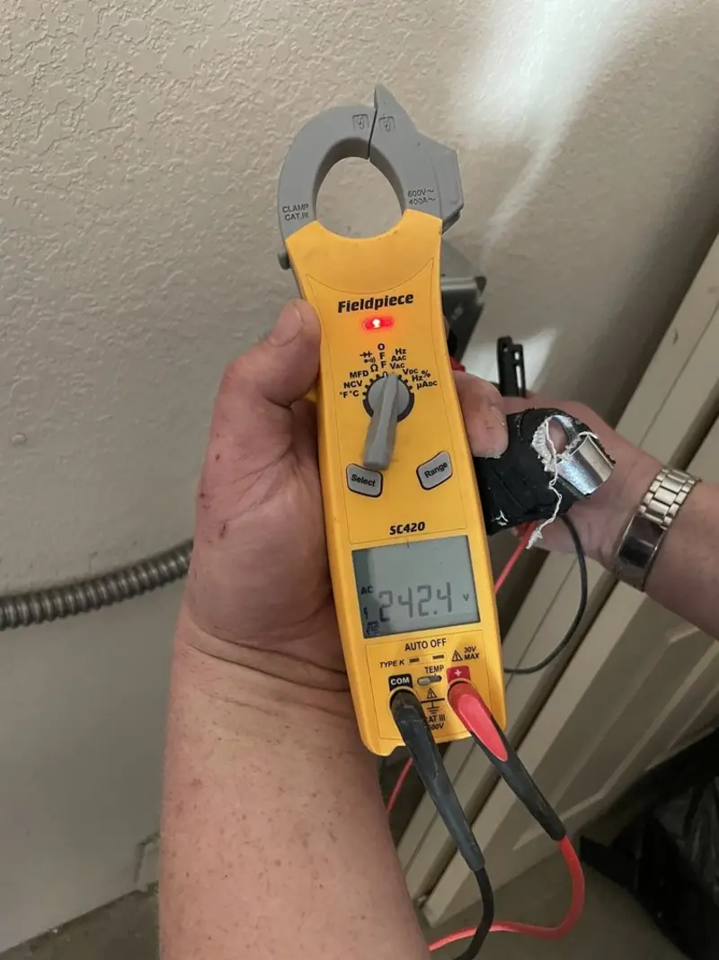 Voltage testing with clamp meter during Whole House Surge Protector in West Mifflin